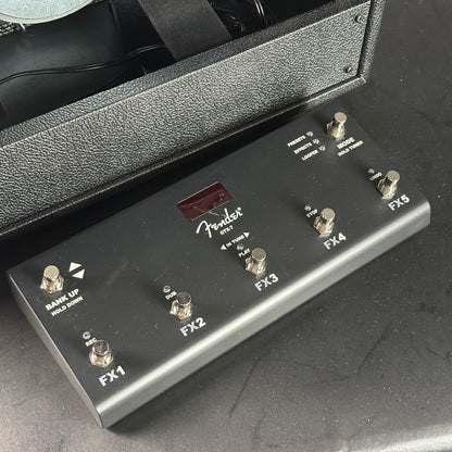 Fender guitar effects pedal on a dark surface