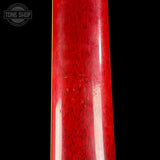 Close-up of a glossy red wooden guitar body or neck against a black background, with a Tone Shop watermark in the upper left corner.
