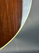 Close-up of a wooden surface with a metallic rim