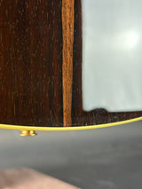 Close-up of a wooden surface with a yellow edge and glass panel.
