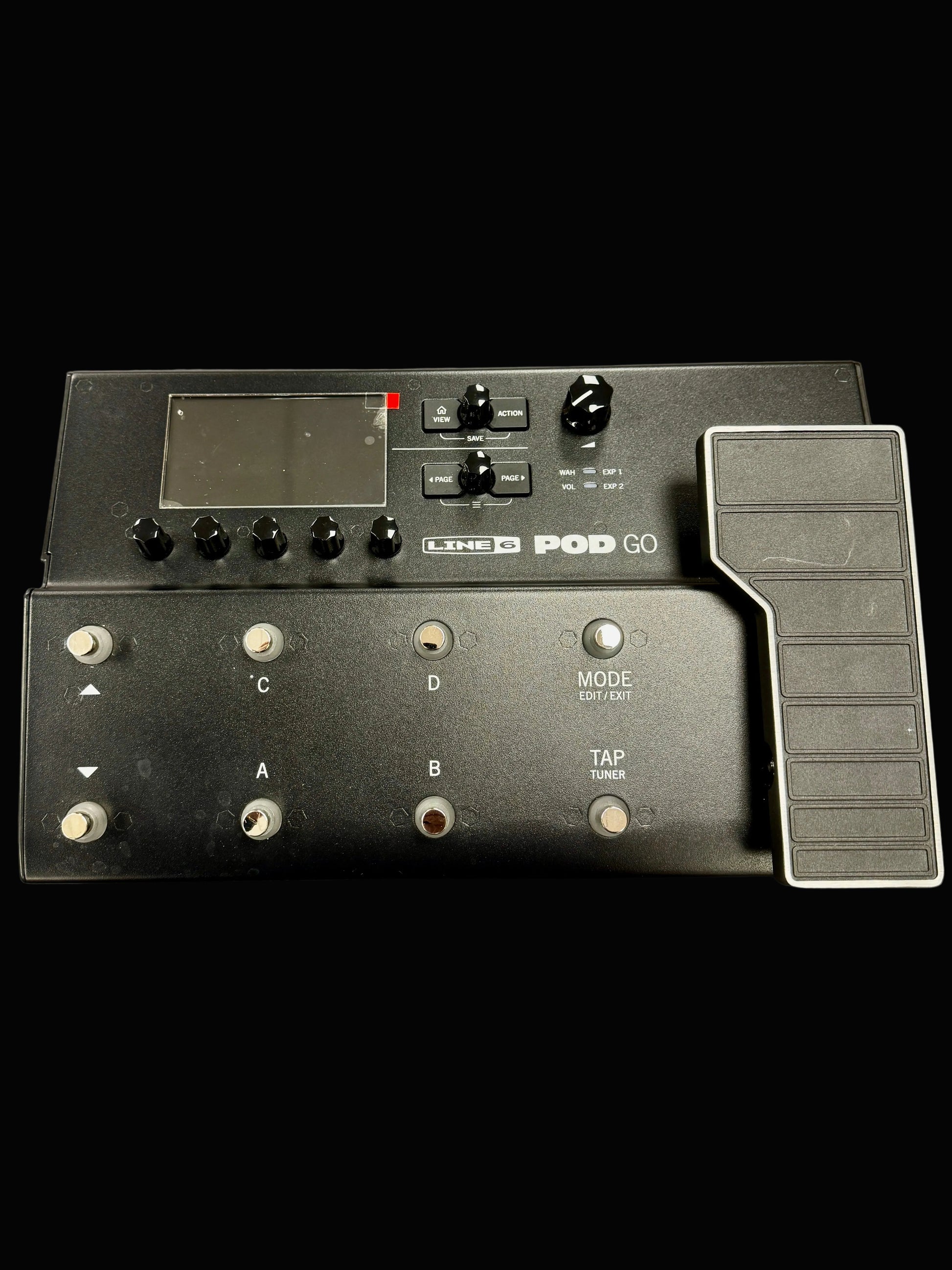 Black Line 6 Pod Go guitar effects processor on a gray surface