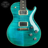 A turquoise blue electric guitar with a flamed maple top, featuring a white pickguard, gold hardware, and a black neck, shown against a solid black background.