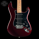 A classic electric guitar with a metallic deep burgundy body, black pickguard, maple neck, and chrome hardware, shown against a solid black background with a Tone Shop watermark in the top left corner.