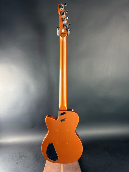 Guitar body with headstock on a gray background