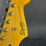 Wear on headstock of Used 2016 Squier Classic Vibe 60's Stratocaster Sunburst.