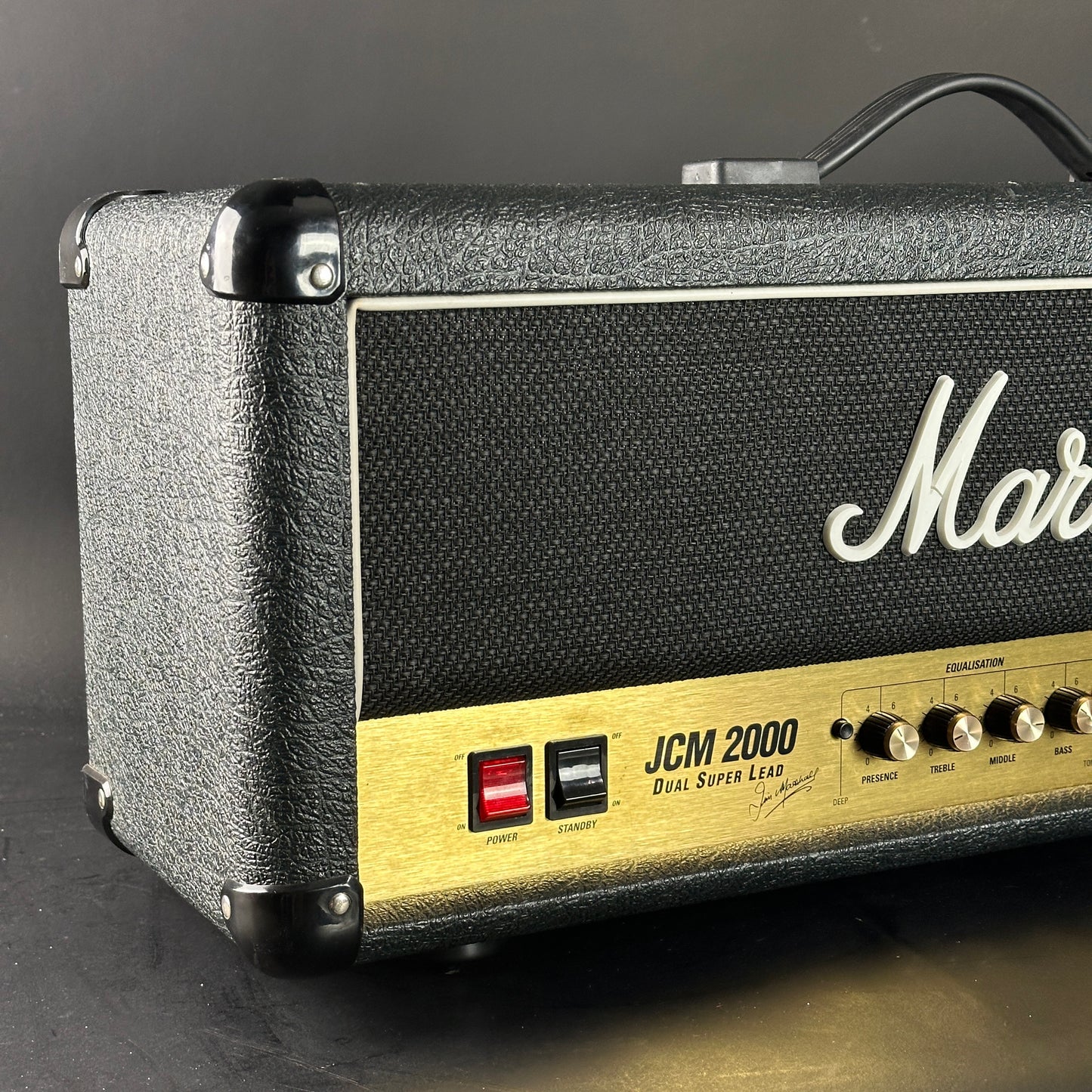 Marshall amplifier head with 'JCM 2000' and 'Dual Super Lead' on a dark background