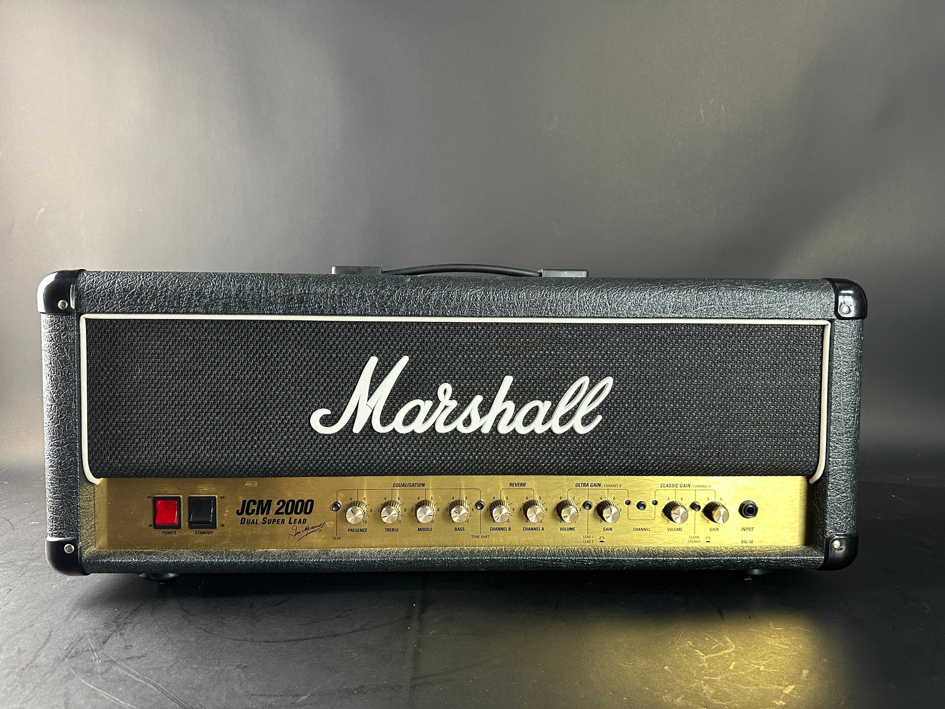 Marshall guitar amplifier head on a gray background