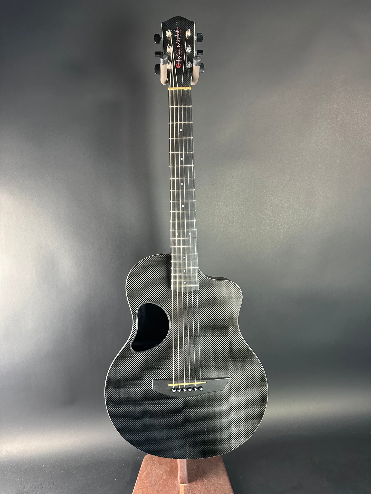 Acoustic guitar on a gray background