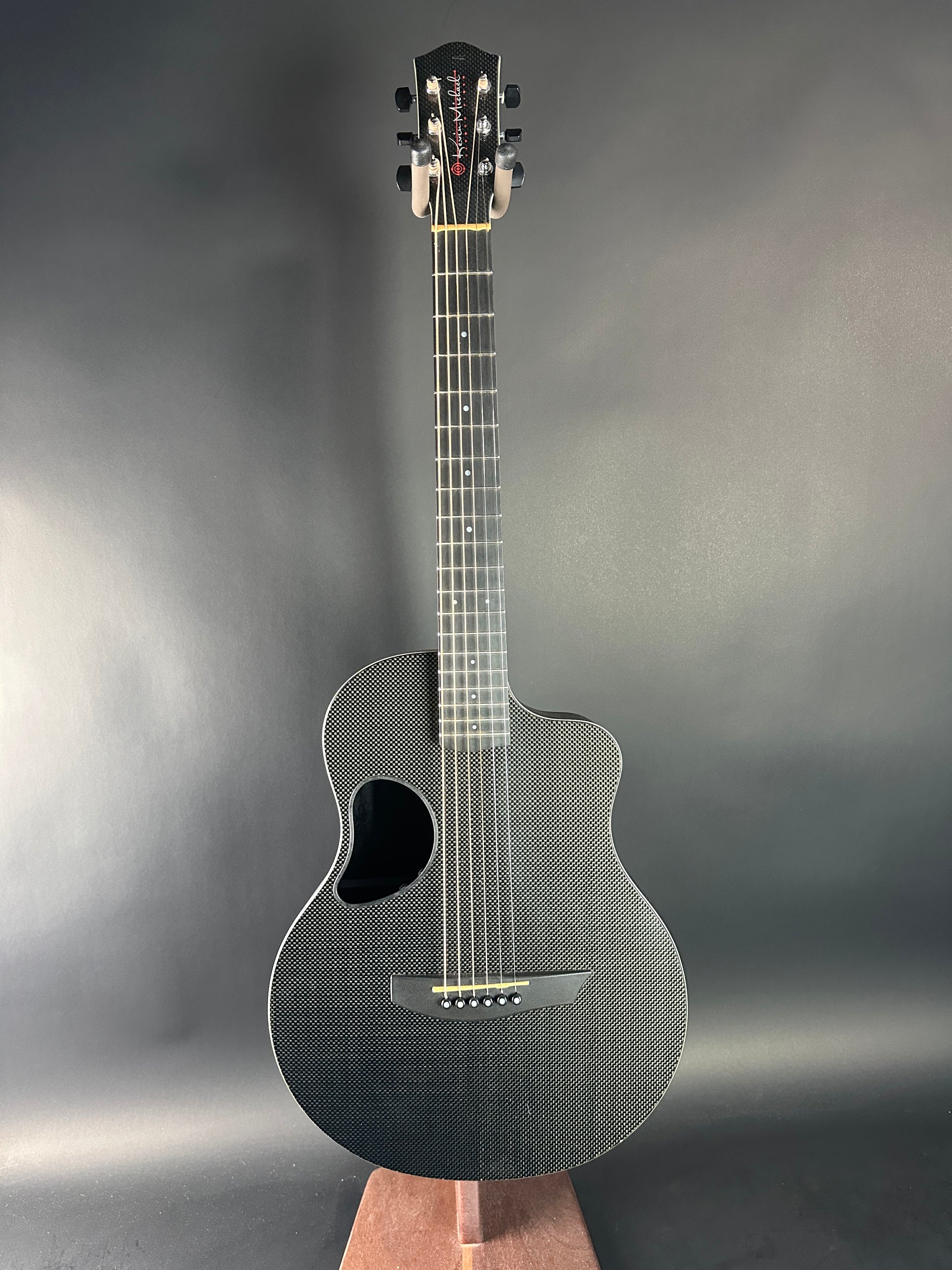 Acoustic guitar on a gray background