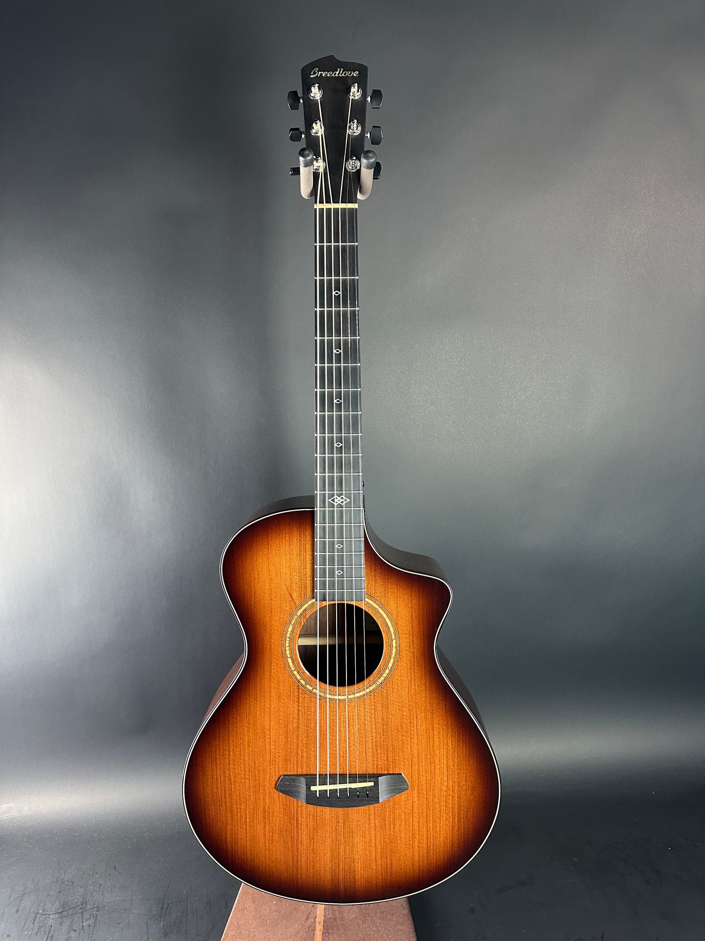 Acoustic guitar on a gray background