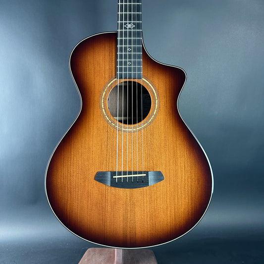 Acoustic guitar with a sunburst finish on a gray background