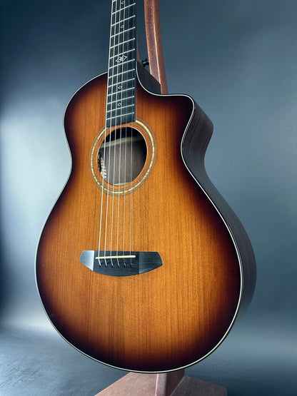 Acoustic guitar with a brown finish on a gradient blue background