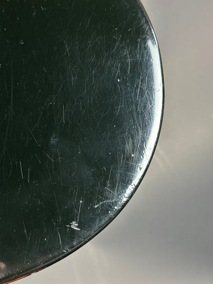 Scratched black surface with a light gray background