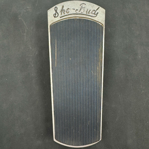 Vintage steel guitar pick-up on a dark background