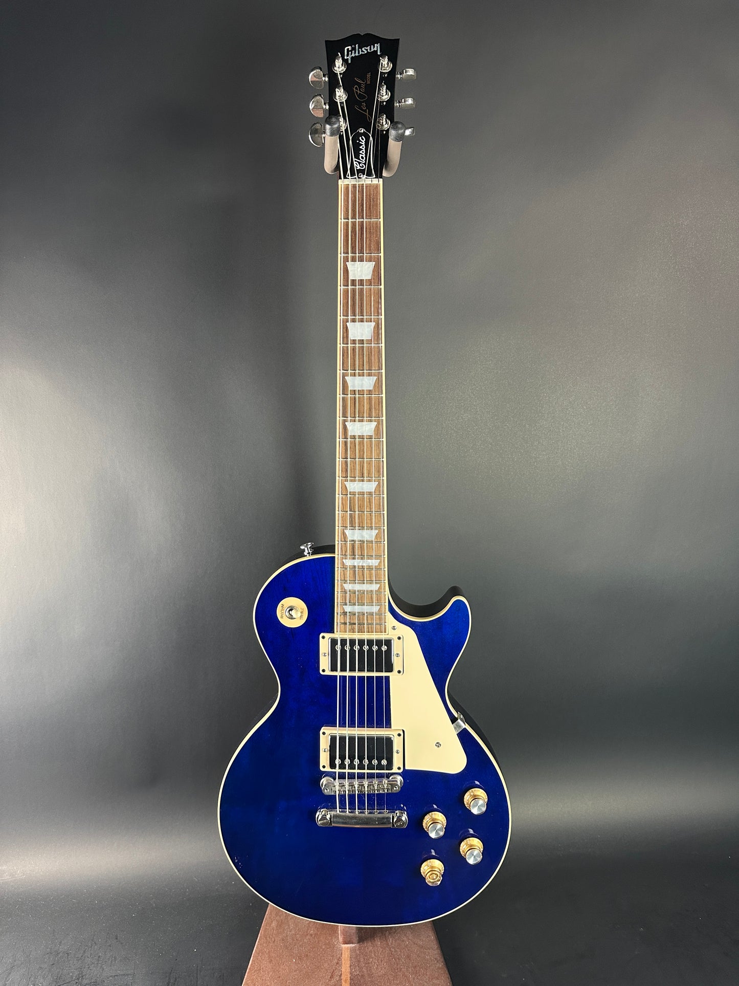 Blue electric guitar on a gray background