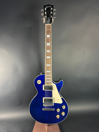 Blue electric guitar on a gray background