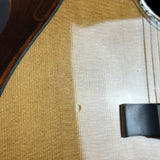 Close-up of a guitar's soundhole and body