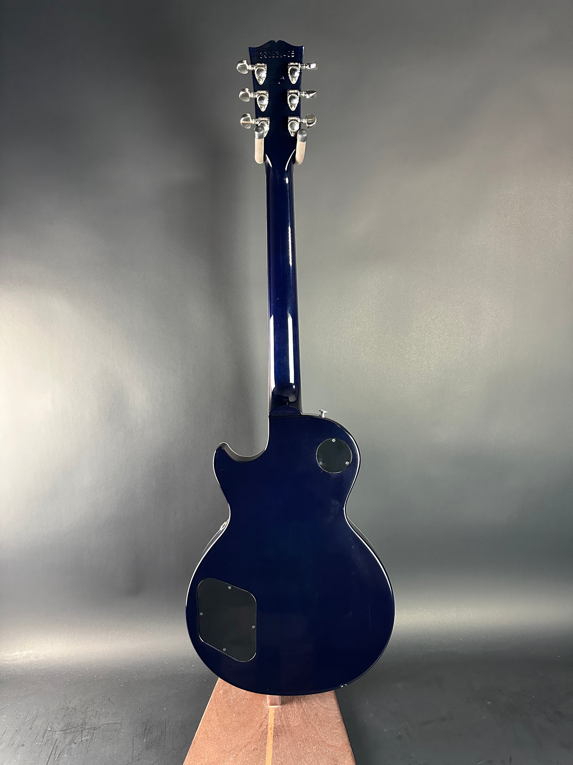 Blue electric guitar on a gray background
