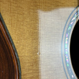 Close-up of a guitar's soundhole and body