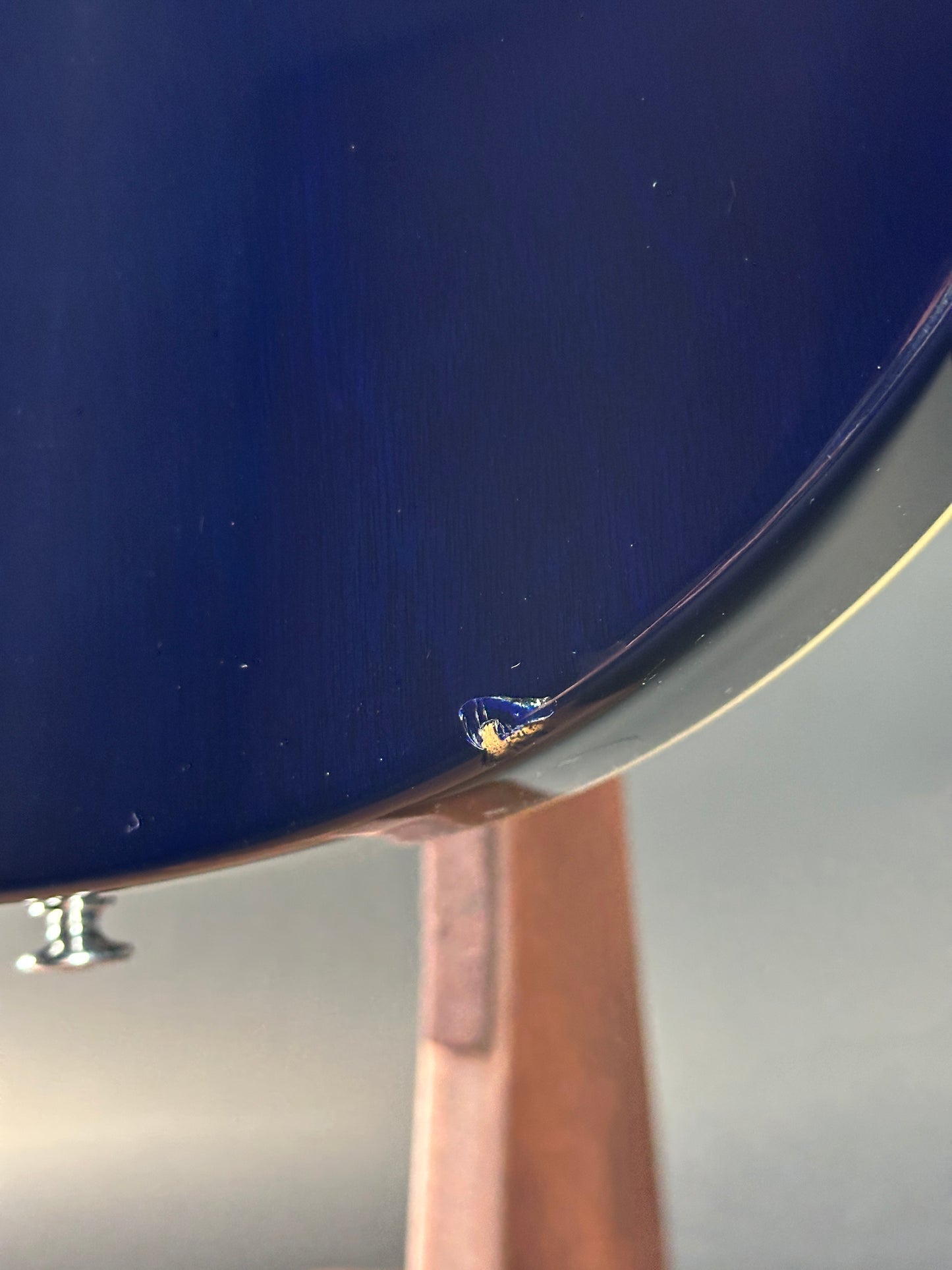 Close-up of a blue surface with a small scratch