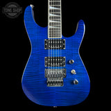 A blue electric guitar with a flamed maple top and black hardware, shown against a black background with a Tone Shop watermark in the upper left corner.