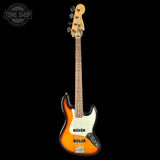 A classic four-string bass guitar with a sunburst finish, featuring a white pickguard and black hardware, shown against a solid black background with a Tone Shop logo in the top-left corner.