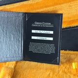 Gibson Custom Certificate of Authenticity on a wooden surface
