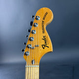 Fender Telecaster Deluxe guitar headstock on a dark gray background