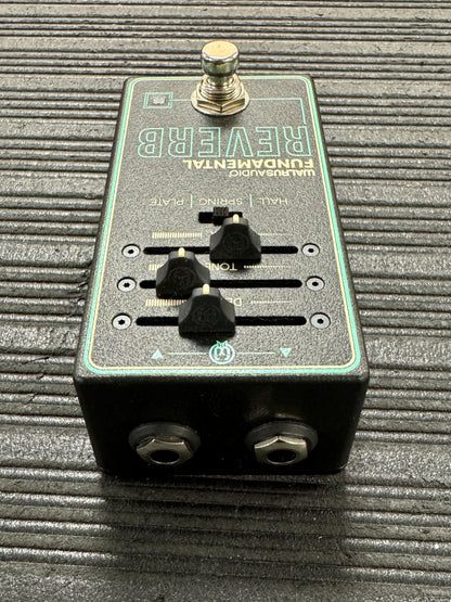 guitar effects pedal on a textured surface