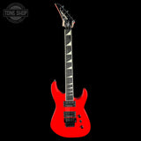 A bright red electric guitar with a black headstock and black pickups, shown vertically against a solid black background. A Tone Shop watermark is visible in the top-left corner.