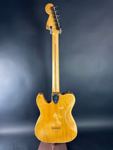 Wooden electric guitar on a dark background