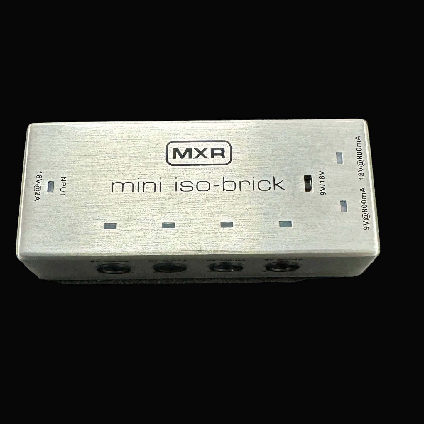 MXR mini iso-brick power supply on a textured surface