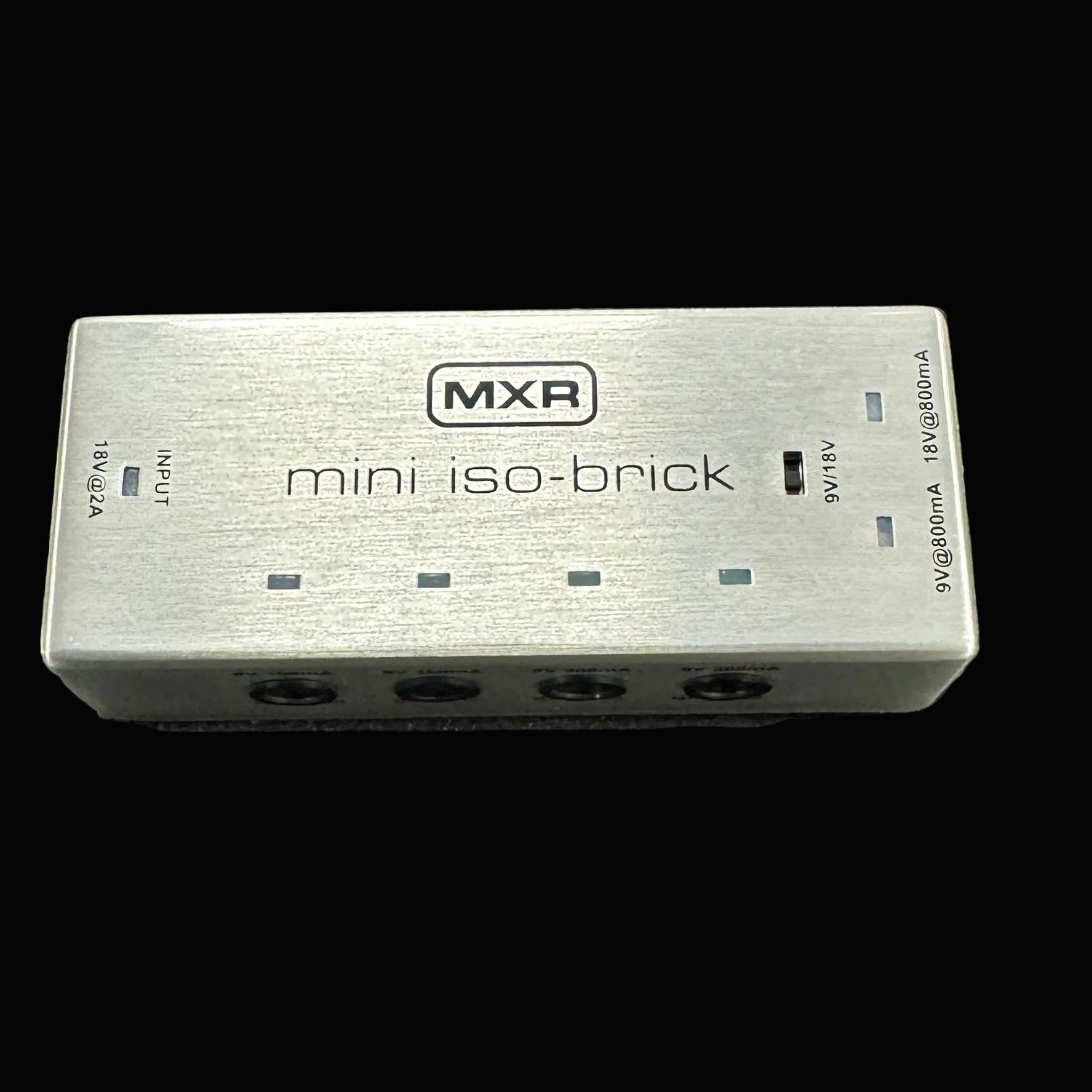 MXR mini iso-brick power supply on a textured surface