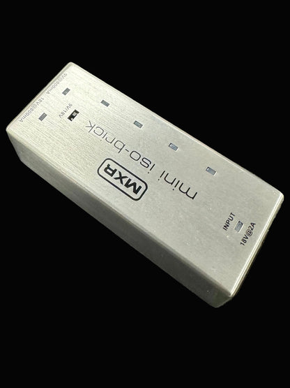 MXR mini ISO-block power supply on a textured surface