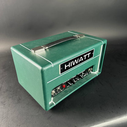 Green Hiwatt amplifier on a gray background