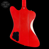 Red electric guitar body on a black background with 'Tone Shop' logo.