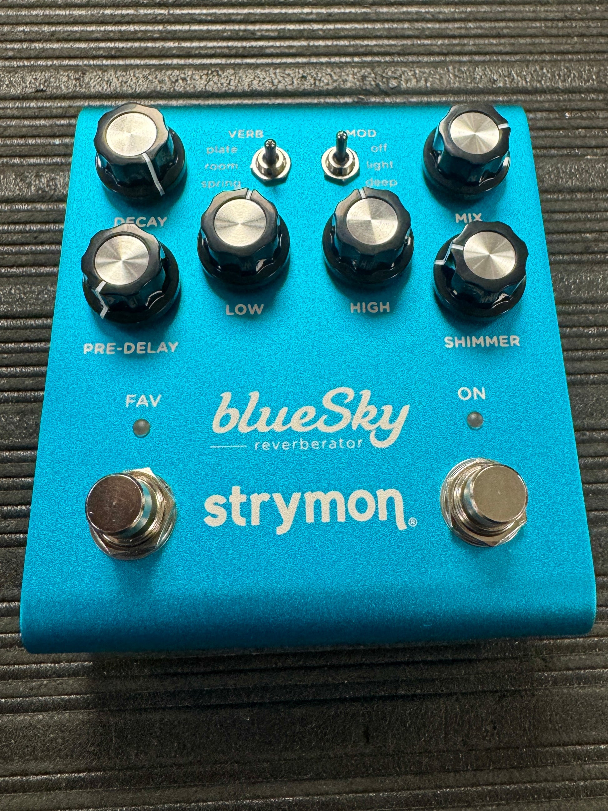 Blue Sky reverberator guitar effects pedal by Strymon on a textured surface