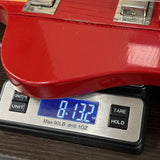 Gibson Custom 1963 Firebird V w/ Maestro Vibrola Light Aged Cardinal Red on scale displaying weight.
