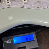 Used 2020 Fender Kenny Wayne Shephard Strat Trans Faded Sonic Blue on scale displaying weight.