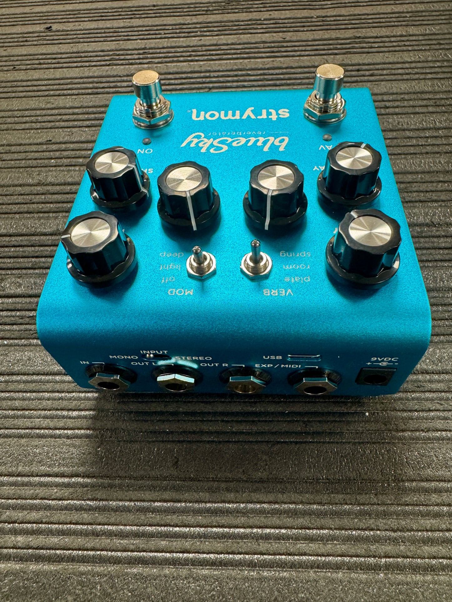 Blue Stleymon guitar effects pedal on a textured surface