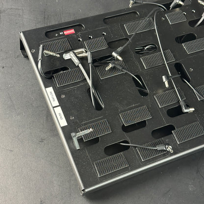 Close-up of a electronic component tray with various small parts on a gray surface