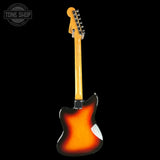 A classic electric guitar shown from the back, featuring a classic sunburst finish that transitions from black to orange and yellow, set against a solid black background.