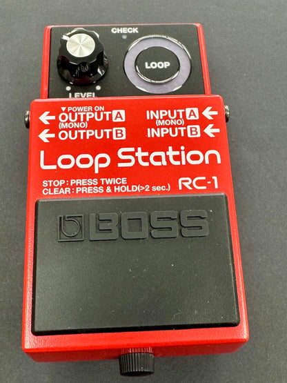 Red Loop Station RC-1 pedal with Boss logo on a dark background