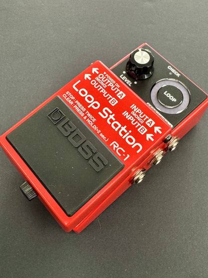 Red and black BOSS Loop Station RC-1 pedal on a gray background