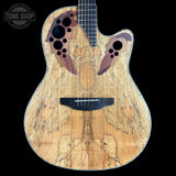 A custom acoustic-electric guitar with a highly figured maple top, featuring a symmetrical wing-like inlay design in reddish-brown and purple tones around the sound holes, set against a solid black background.