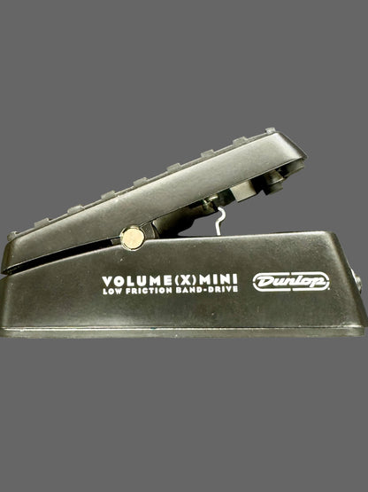 Black Dunlop volume pedal on a gray background