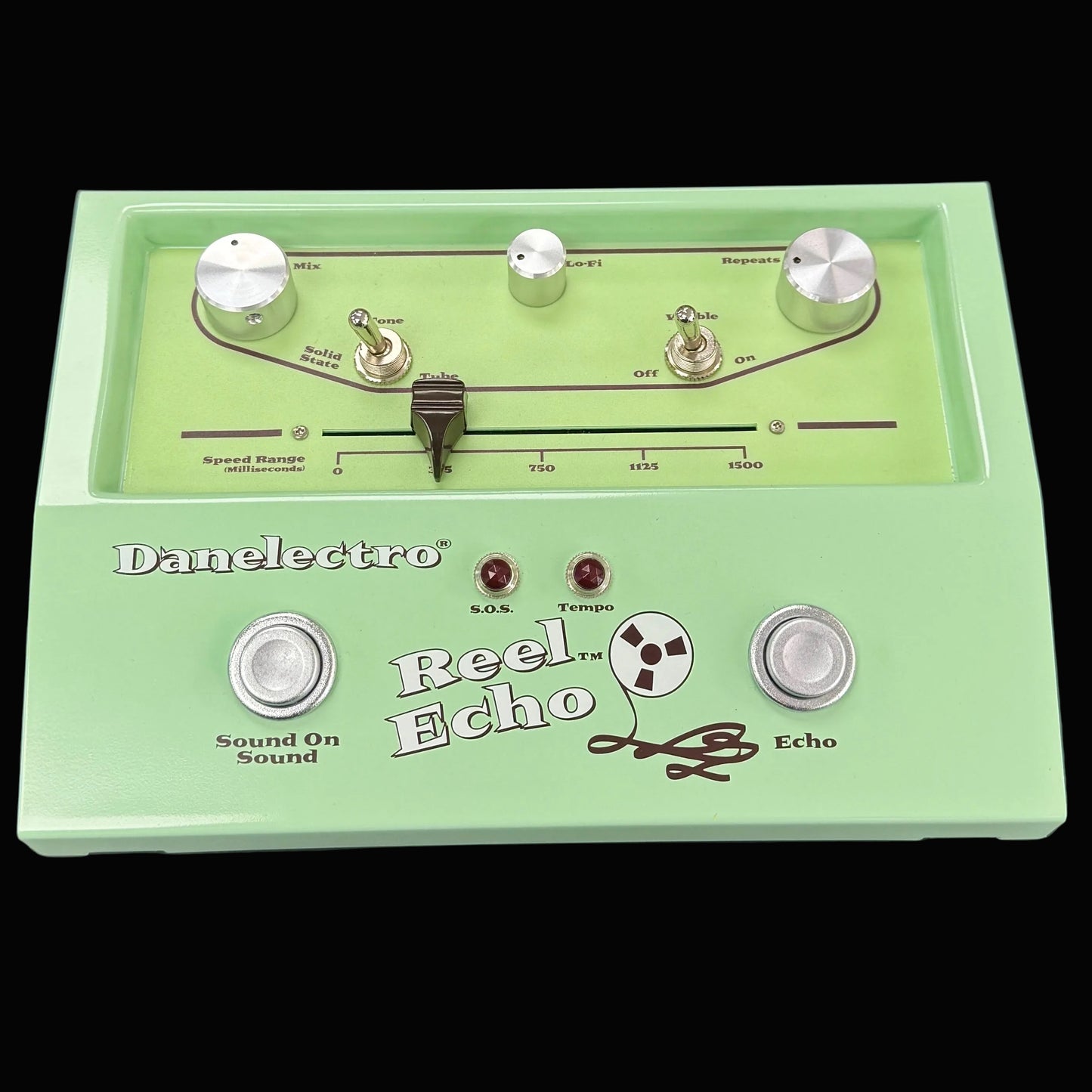 Green Danelectro Reel Echo pedal on a dark background