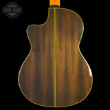 The back of an acoustic-electric guitar with a glossy brown wood finish, featuring a yellow binding edge and a black-and-white Tone Shop logo watermark in the top left corner.