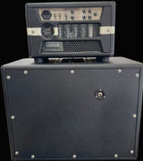 Guitar amplifier with a smaller amplifier on top in a store setting