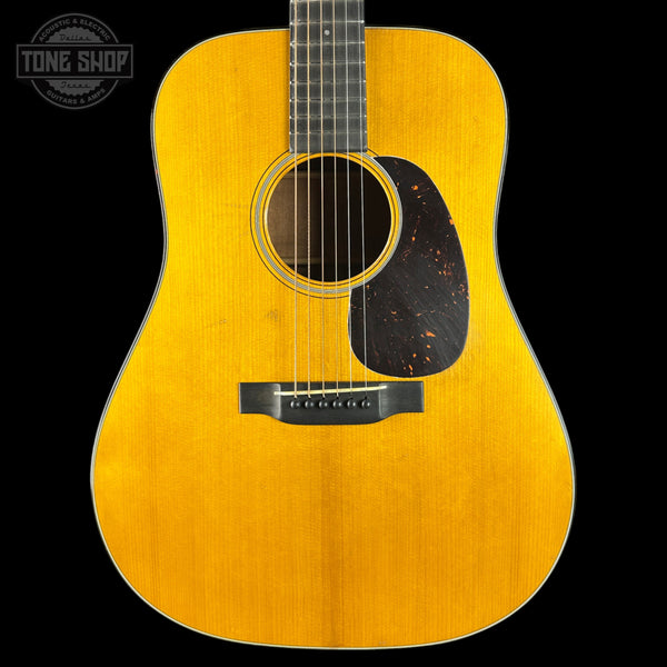 Acoustic guitar with a visible brand logo in the corner